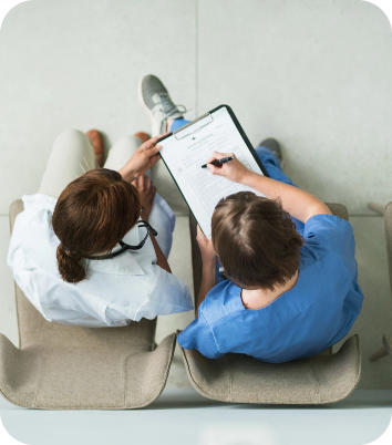 Two people looking at documents